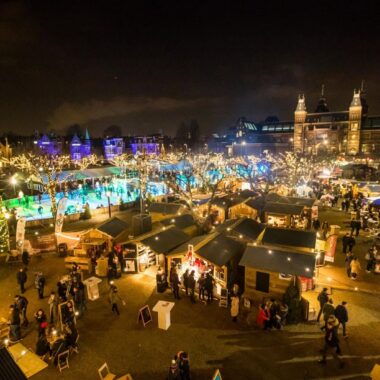 Christmas Village on Museumplein with ice rink and Rijksmuseum, Amsterdam