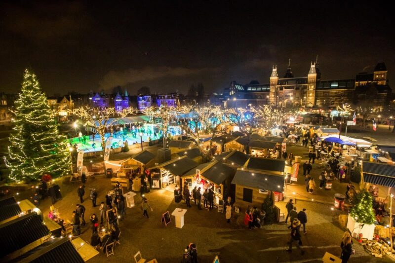 Christmas Village on Museumplein with ice rink and Rijksmuseum, Amsterdam